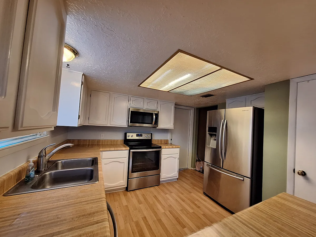 New Kitchen with stainless appliances - 8106 Windy Acres Dr