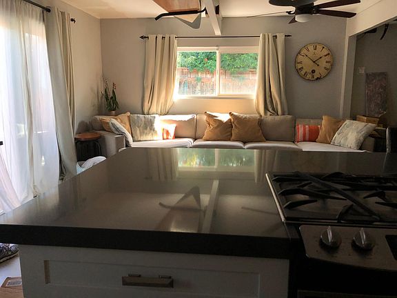 Livingroom: Slider (to fenced-in front entertaining area) window (faces garden along side walkway)