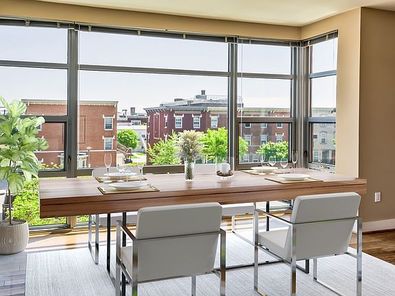 Floor to ceiling windows in each home and wood flooring throughout