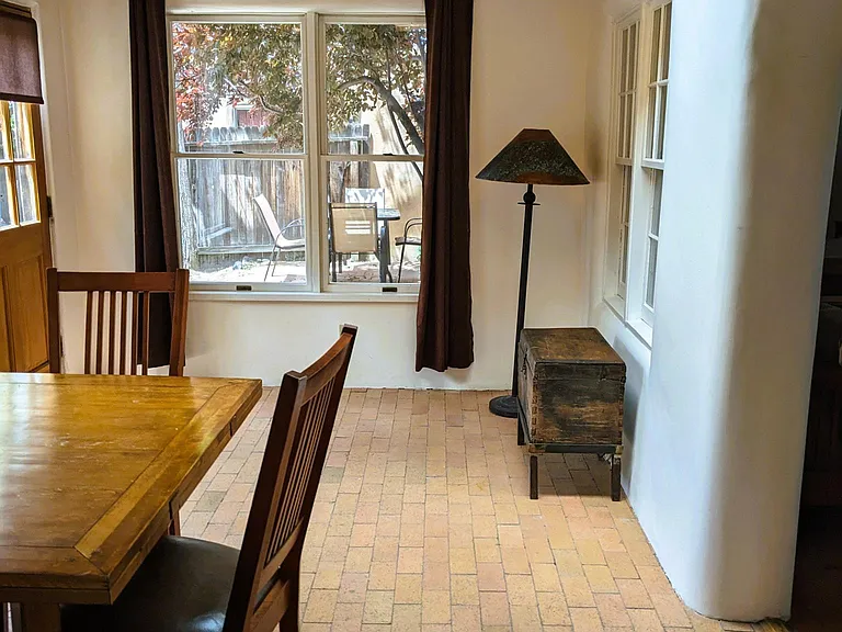 Sunroom dining with radiant heat and skylight