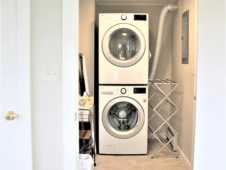Main floor laundry room with additional door leading outside to back yard.