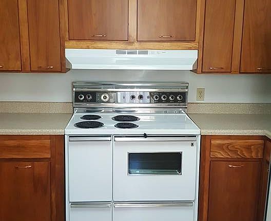 kitchen with ceiling to floor storage cabinets