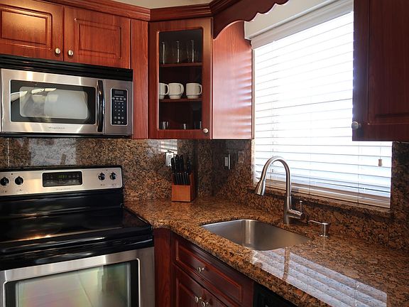 Marble Kitchen with wooden cabinetry