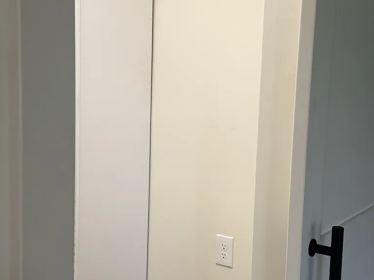 A handy fridge-with freezer top fridge can go here to add more utility to adjacent kitchen fridge.
