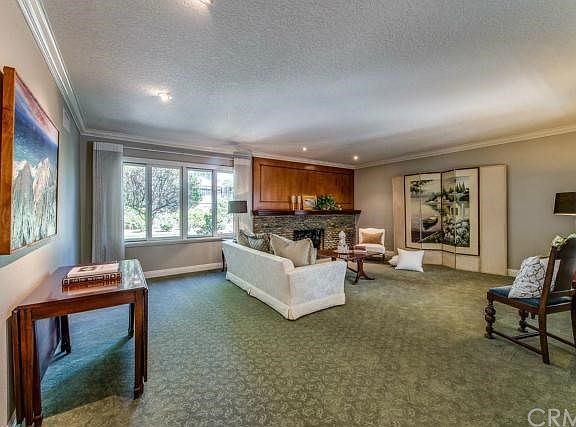 Formal Living Room with River Rock Fireplace