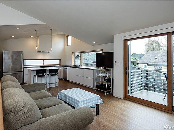 kitchen, living area, view of balcony