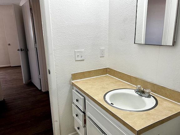 Vanity freshly caulked and painted.