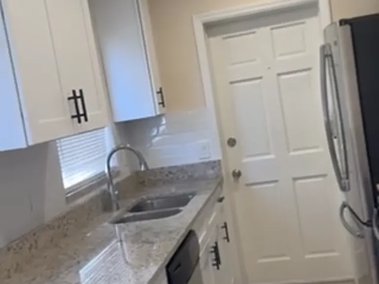Brand new kitchen with high quality cabinets, beautiful granite counters and porcelain floors.