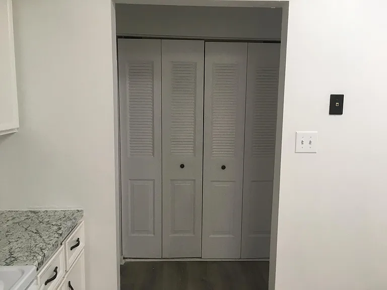 Laundry room is behind the folding doors. HVAC and water heater are in there.