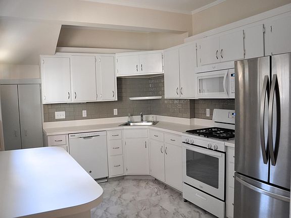 The kitchen has a breakfast bar and a pantry.