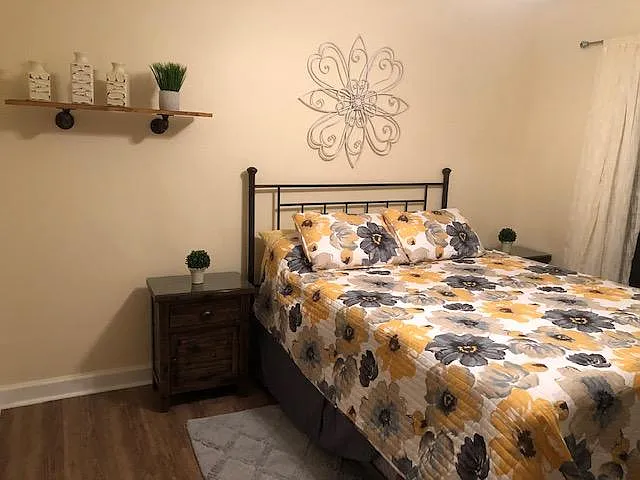 Queen bed in guest bedroom