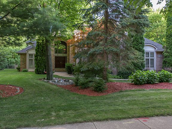 Magnificent Custom Built Home!  Over 4000 Square Feet of quality open space.  It all starts with a 2 story foyer with a unique light fixture.  This home contains 5 bedrooms and 4 full baths, 2 fireplaces, beautiful oak flooring and trim.   The large gourmet kitchen has a gas stove, all appliances, large pantry and a large island.  Master suite has a beautiful bath and walk-in closet.  The finished lower level has the 5th bedroom, recreation room and 2 egress windows.   