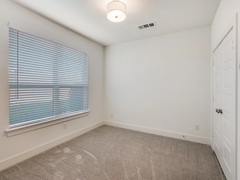 Bedroom #1 with large closet and lots of natural sunlight.