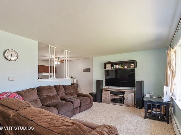 Large family room with beautiful bay windows that opens up in to the kitchen.