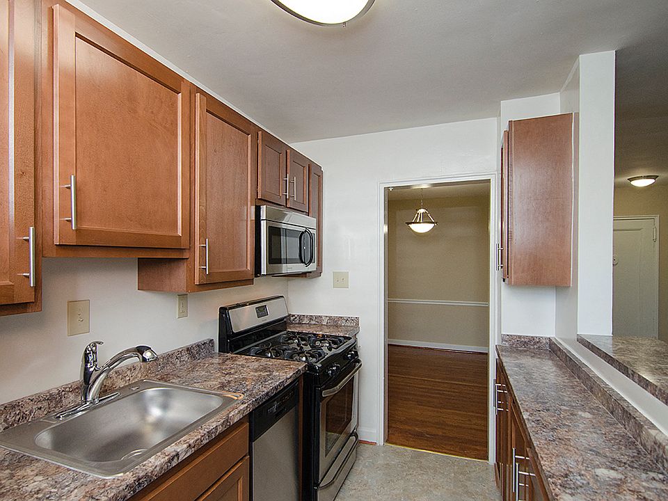 Partially renovated kitchen with stainless steel appliances