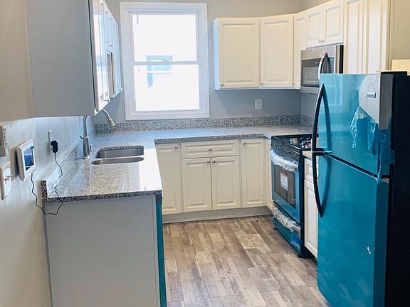 Kitchen: granite countertop, stainless steel appliances with two lazy susan's