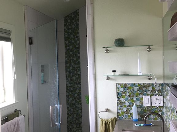 Custom-built shower and sink, and Italian rubber floor tile.