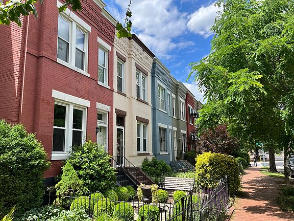 Street view of dynamically colored rowhouses