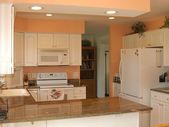 Granite countertops, hardwood floors and plenty of cabinet storage
