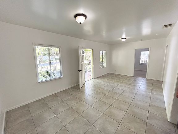 Front entrance and large Living Room with Dining Area