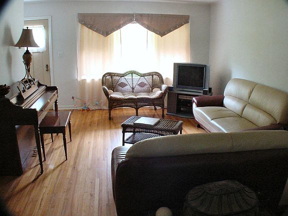 Living Room shown with previous tenant's furniture (not included with rental)