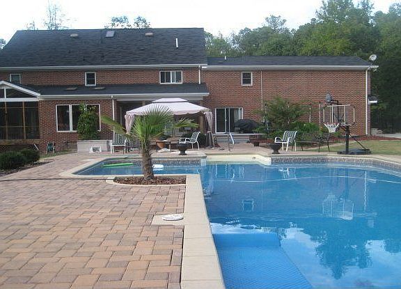 Beautiful brick pavers surrounding the pool