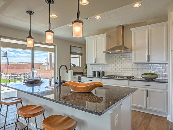 Kitchen island creates a casual space for busy morning breakfasts or weekend brunch spreads.