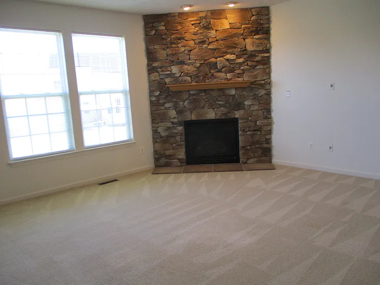 View of Fireplace with Accent Lights