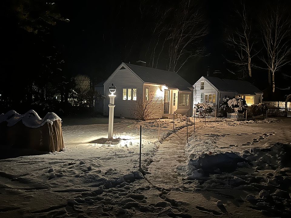 Pretty snowy night in Kennebunk. Yard on the left of the sidewalk is the cottages space, on the right of the sidewalk is common area