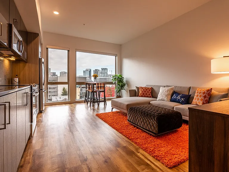 Apartment Interior Featuring Kitchen, Dining Area, and Large Windows