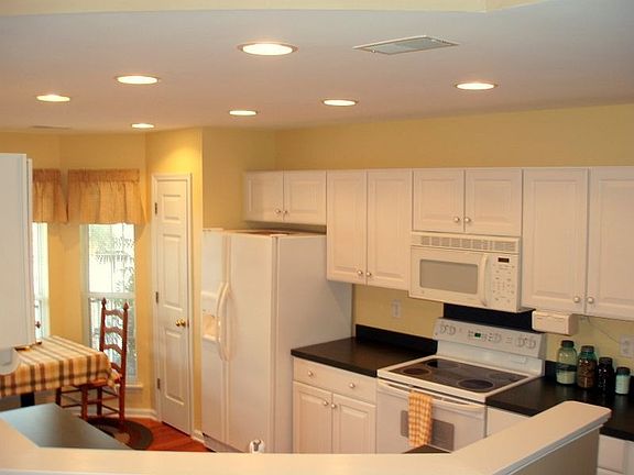 Spacious kitchen with pantry and dinette.