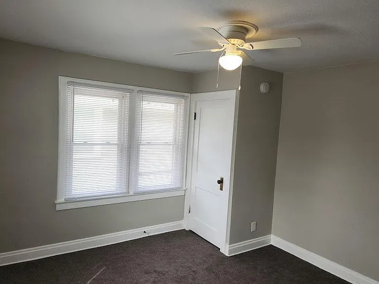 Back Bedroom 12'9" x 11'2", new ceiling fan, 3 windows cordless blinds, carpet, two closets