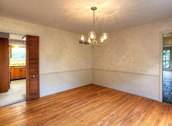 The formal dining room opens to the entry hall and also to the k