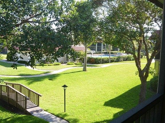 The center grounds. Beautiful sidewalks to bridges that connect across this wonder fully landscaped area. The Olympic size pool, bathrooms & recreation area is just outside our unit.