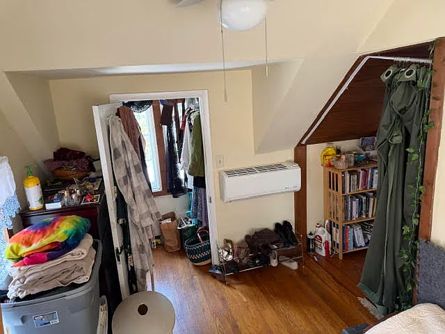 Bedroom with attached walk-in closet