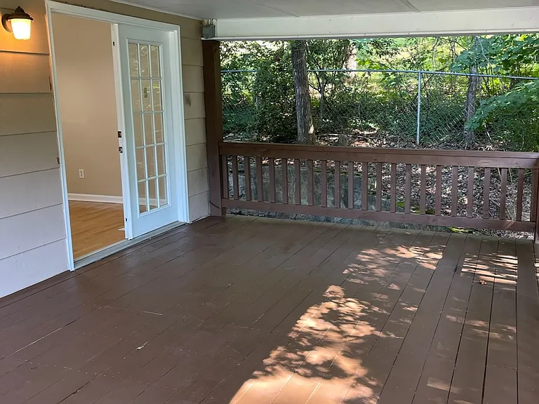 Upstairs Refinished deck overlooking back yard.