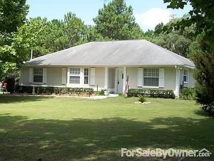 Front View
						:
						Solid concrete blk home, large open front yard.