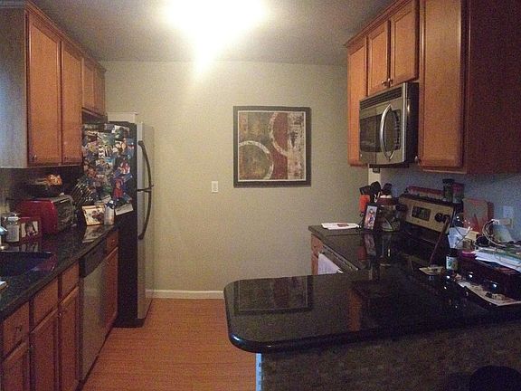 Kitchen w/ Stainless Steel appliance and granite countertop