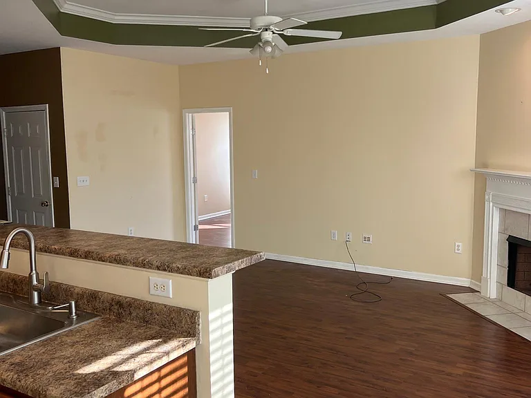 Den with gas fireplace.