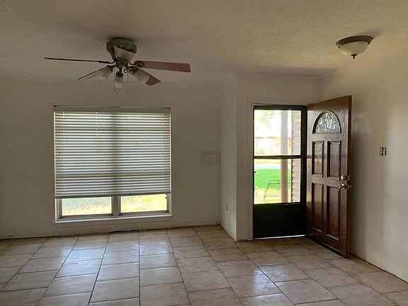 Living room looking from backyard to the front door toward the street