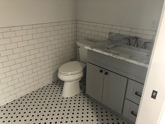 Main house has New bath with new flooring, plumbing and fixtures.