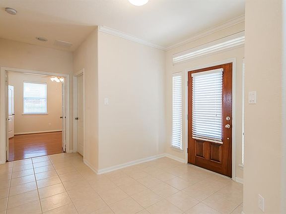 Front door! This home is light and bright with neutral colors throughout.