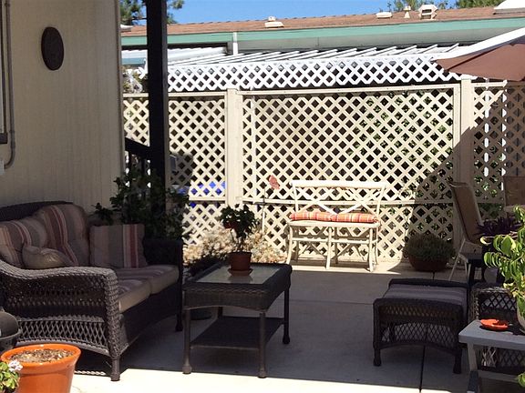 Private back patio with covered seating area.