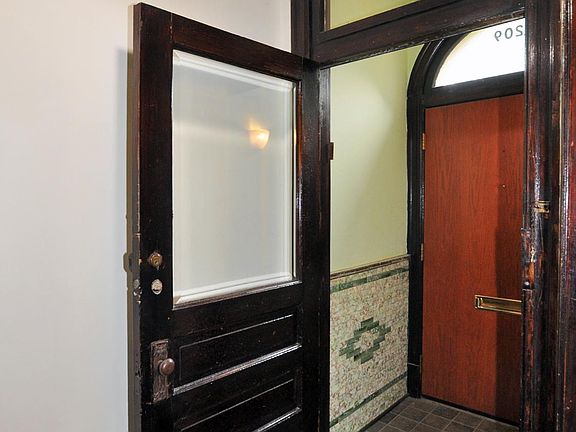 Double entry with original tiles.