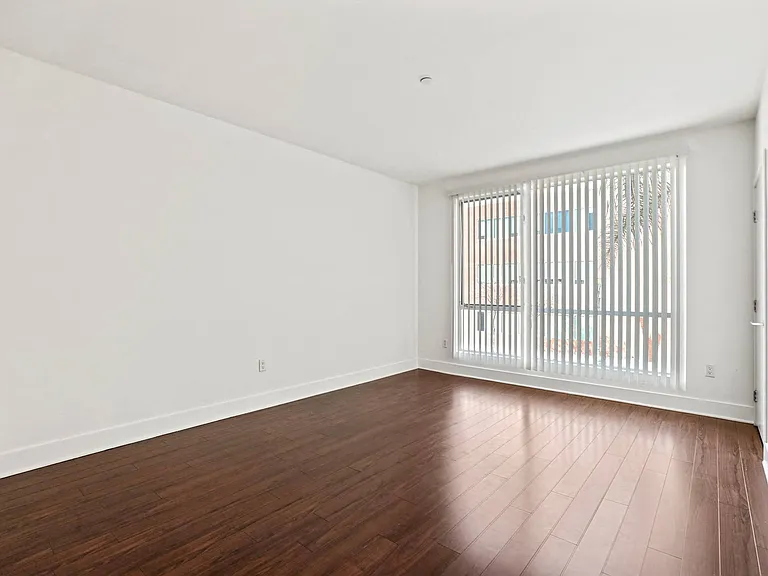 Bedroom with Vinyl Flooring and Large Windows