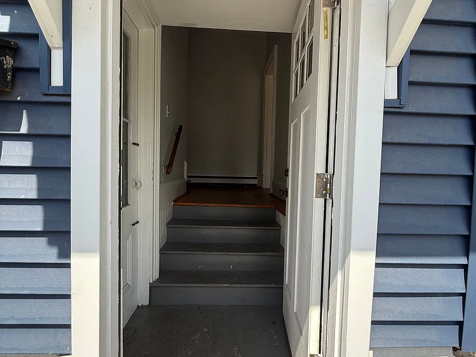 Entryway is immediately off driveway.
