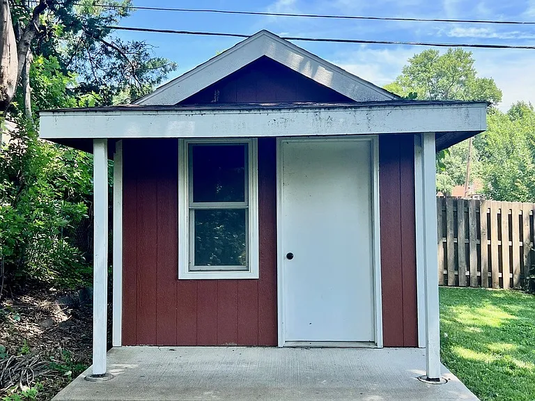 Stand alone 10 x16 shed in backyard is perfect space for workshop or extra storage.