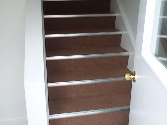 ENTRY WAY TO PLACE YOUR BOOTS OR SHOES AND INSIDE STAIRS UP TO UNIT, CLEAN AND NEW