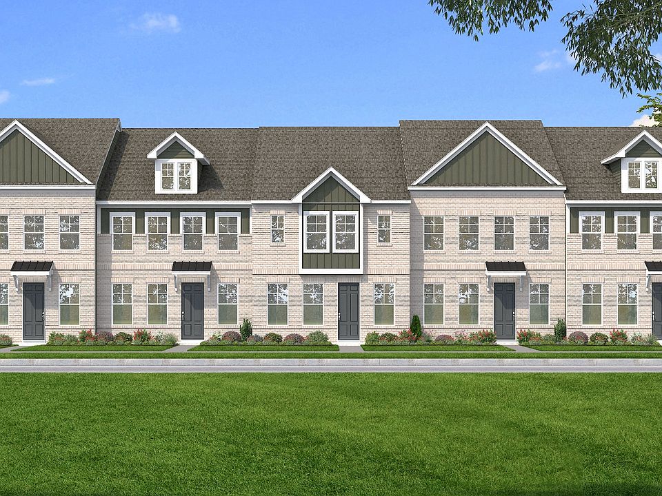 Townhome Exteriors with brick fronts and Hardie siding accents