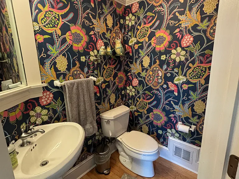 Quirky, functional half bath attached to the gourmet kitchen.